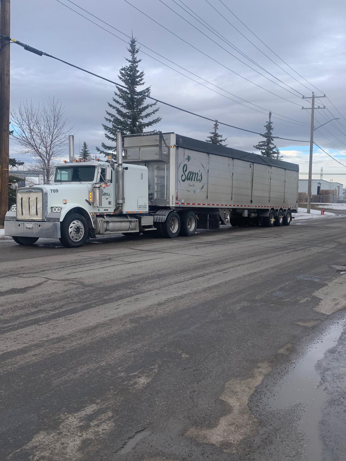 Sam’s Services hauling truck